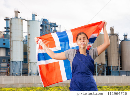 Upset young woman holds the national flag of Norway 111964726