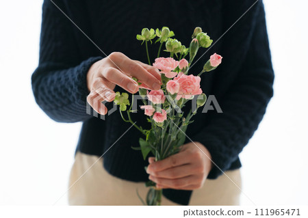 Female hand with flowers Female hand with flowers 111965471
