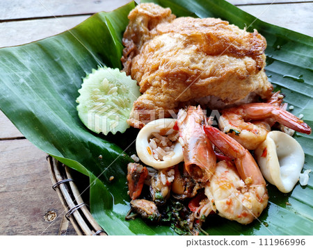 Stir-fried seafood with basil, Thai style food Stir-fried seafood with basil, Thai style food 111966996