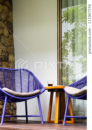 Summer lounge terrace. Patio area with two chairs and table. Summer lounge terrace. Patio area with two chairs and table. 111967356