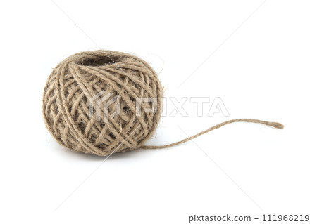 Spool of jute twine isolated on white background Spool of jute twine isolated on white background 111968219