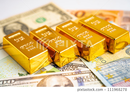 Gold bar on US dollar and Euro banknote, economy finance exchange trade investment. Gold bar on US dollar and Euro banknote, economy finance exchange trade investment. 111968278