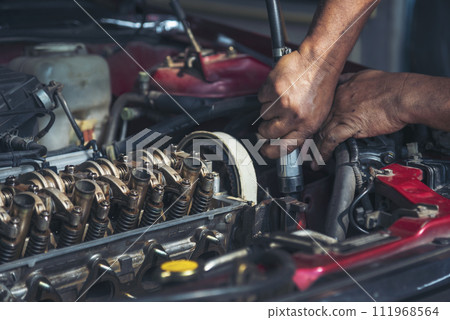Close up Man hands fixing Car machinery vehicle mechanical service. Mechanic man hands repairing car auto repair shop. open vehicle hood checking up auto mobile. Vehicle Car maintenance engineer. 111968564