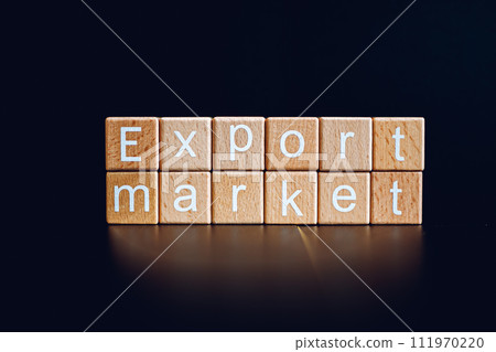 Wooden blocks form the text "Export market" against a black background. 111970220
