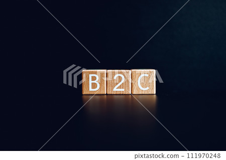 Wooden blocks form the text "B2C" against a black background. 111970248