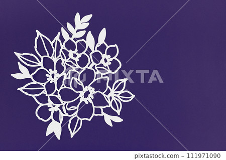 Carve of white paper flower and leaves with copy space on cardboard background. Carve of white paper flower and leaves with copy space on cardboard background. 111971090