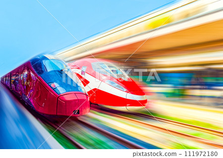 Modern hi-speed passenger train, in movement (motion) on railways station. Modern hi-speed passenger train, in movement (motion) on railways station. 111972180