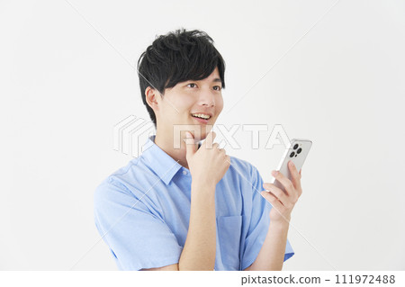 A man imagining holding a smartphone, white background 111972488