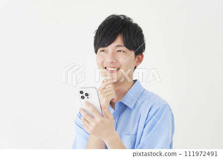 A man imagining holding a smartphone, white background 111972491