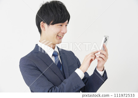 Businessman using a smartphone, white background 111972533