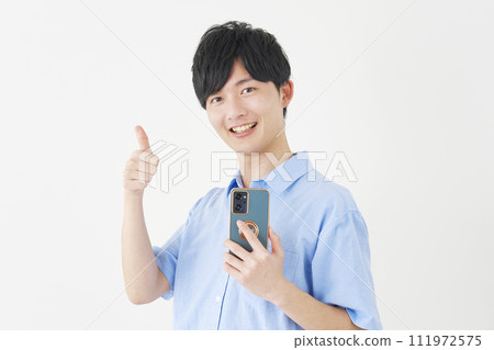A man holding a smartphone and giving a good sign, white background A man holding a smartphone and giving a good sign, white background 111972575