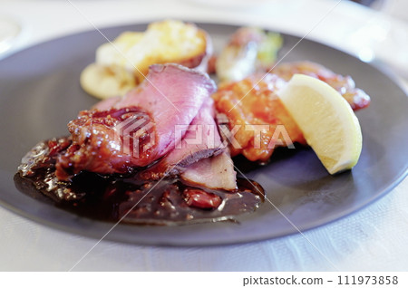 Luxury dinner roast beef and garnishes Luxury dinner roast beef and garnishes 111973858