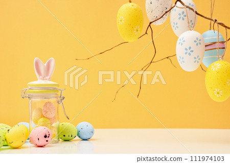 Happy Easter concept with eggs and jar bunnies with sweets and candies. Egg hunt with twigs. Copy space 111974103