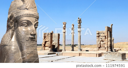 Horizontal banner with Gate of All Nations (Xerxes Gate) and face of assyrian protective deity lamassu - human-headed winged bull, Persepolis, Iran 111974591