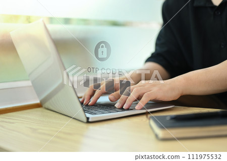 Hands typing on laptop, entering verification code for login. User privacy security and protect personal data concept Hands typing on laptop, entering verification code for login. User privacy security and protect personal data concept 111975532