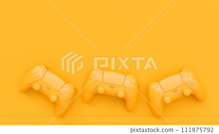 Video game joysticks or gamepads in plain monochrome yellow color background 111975792