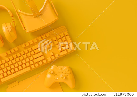 Modern home office setup featuring keyboard, VR glasses and headphones 111975800