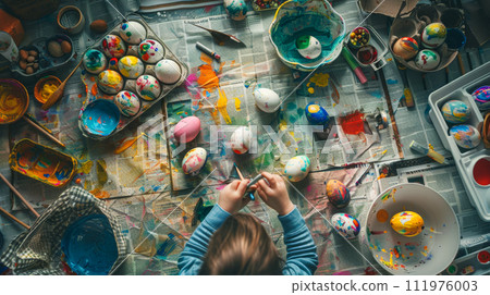 a child enthusiastically creates Easter egg masterpieces 111976003