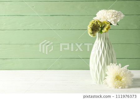 Fresh, beautiful flowers on a green background. 111976373