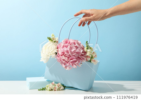 Beautiful, fresh flowers on a blue background. 111976419