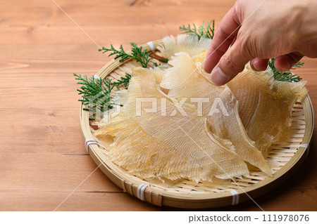 Delicacy Stingray fin (wood grain background) Delicacy Stingray fin (wood grain background) 111978076