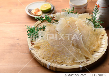 Delicacy Stingray fin (wood grain background) Delicacy Stingray fin (wood grain background) 111978092