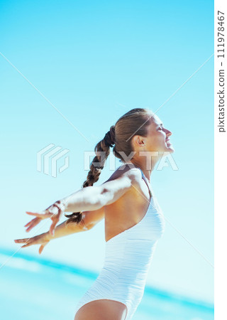 happy young woman rejoicing at seaside 111978467