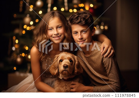 a family photo in the midst of a christmas tree with two children and dog a family photo in the midst of a christmas tree with two children and dog 111978845
