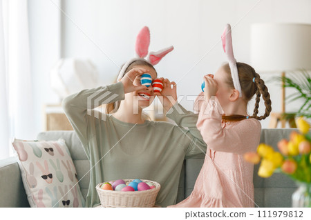 children wearing bunny ears on Easter day 111979812