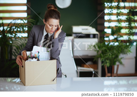 concerned modern woman worker in modern green office 111979850