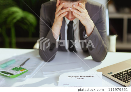 Closeup on modern woman employee in modern green office 111979861
