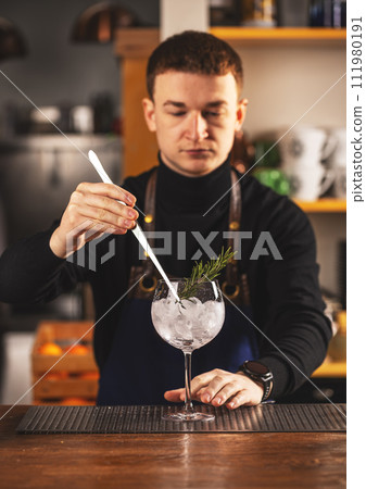 Expert barman is making cocktail Expert barman is making cocktail 111980191