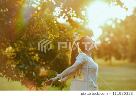 smiling elegant woman in white shirt rejoicing 111980338