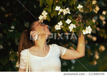 happy modern female in white shirt with eyeglasses 111980344