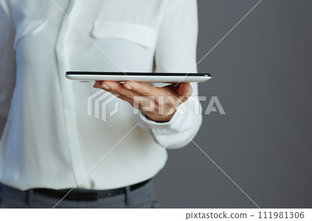 Closeup on woman employee isolated on grey background 111981306