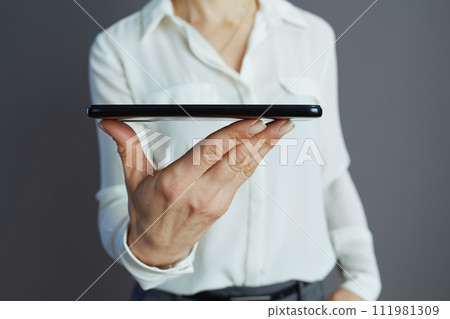 Closeup on woman employee isolated on grey 111981309