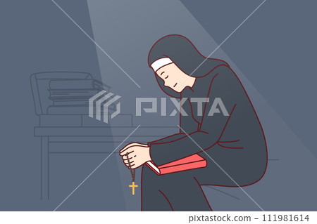 Woman nun sits with head bowed and holds religious crucifix and book of prayers. 111981614