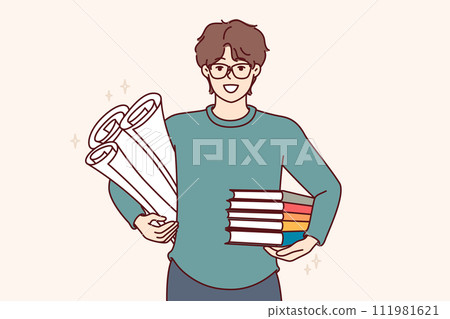 Man student with textbooks and papers for creating engineering drawings, smiles and looks at screen Man student with textbooks and papers for creating engineering drawings, smiles and looks at screen 111981621