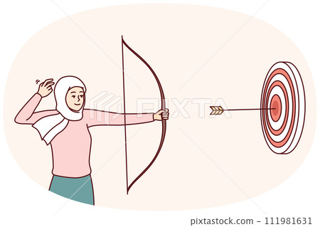 Woman in Islamic headscarf covering hair shoots at target with bow hitting middle 111981631