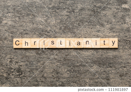 christianity word written on wood block. christianity text on table, concept christianity word written on wood block. christianity text on table, concept 111981897
