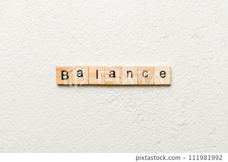 balance word written on wood block. balance text on cement table for your desing, concept 111981992
