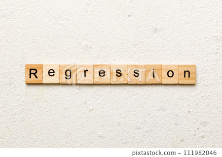 regression word written on wood block. regression text on cement table for your desing, concept regression word written on wood block. regression text on cement table for your desing, concept 111982046