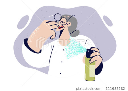 Elderly woman uses air freshener to get rid of harmful smell in apartment, and covers nose 111982282