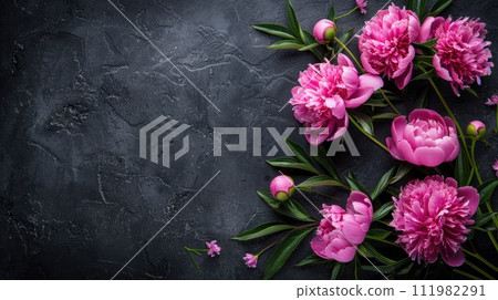 Peonies in a stunning dark-colored frame. Black floral backdrop. Illustrating a festive flower theme Peonies in a stunning dark-colored frame. Black floral backdrop. Illustrating a festive flower theme 111982291