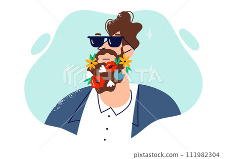 Man with flowers in beard works as florist, or uses beard shampoo with scent of wild flowers 111982304
