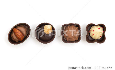 Various chocolate candies isolated on white background. View from above 111982566