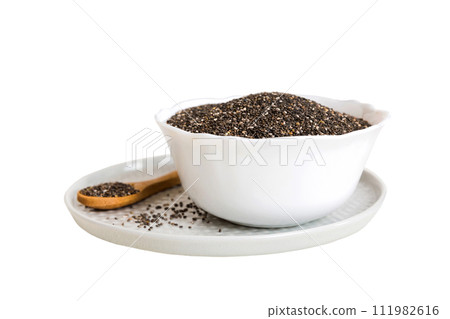Chia seeds in bowl and spoon on colored background. Healthy Salvia hispanica in small bowl. Healthy superfood Chia seeds in bowl and spoon on colored background. Healthy Salvia hispanica in small bowl. Healthy superfood 111982616