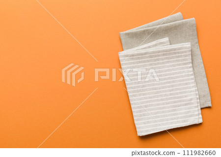 top view with gray kitchen napkin isolated on table background. Folded cloth for mockup with copy space, Flat lay. Minimal style 111982660