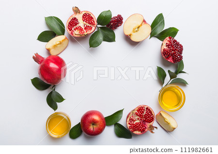 Rosh hashanah concept. Frame made of symbols jewish New Year holiday Traditional. Top view with copy space Rosh hashanah concept. Frame made of symbols jewish New Year holiday Traditional. Top view with copy space 111982661