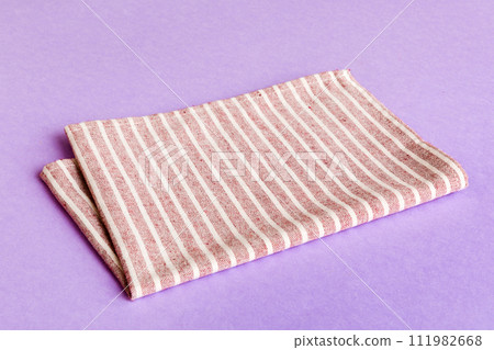 top view with red empty kitchen napkin isolated on table background. Folded cloth for mockup with copy space, Flat lay. Minimal style top view with red empty kitchen napkin isolated on table background. Folded cloth for mockup with copy space, Flat lay. Minimal style 111982668